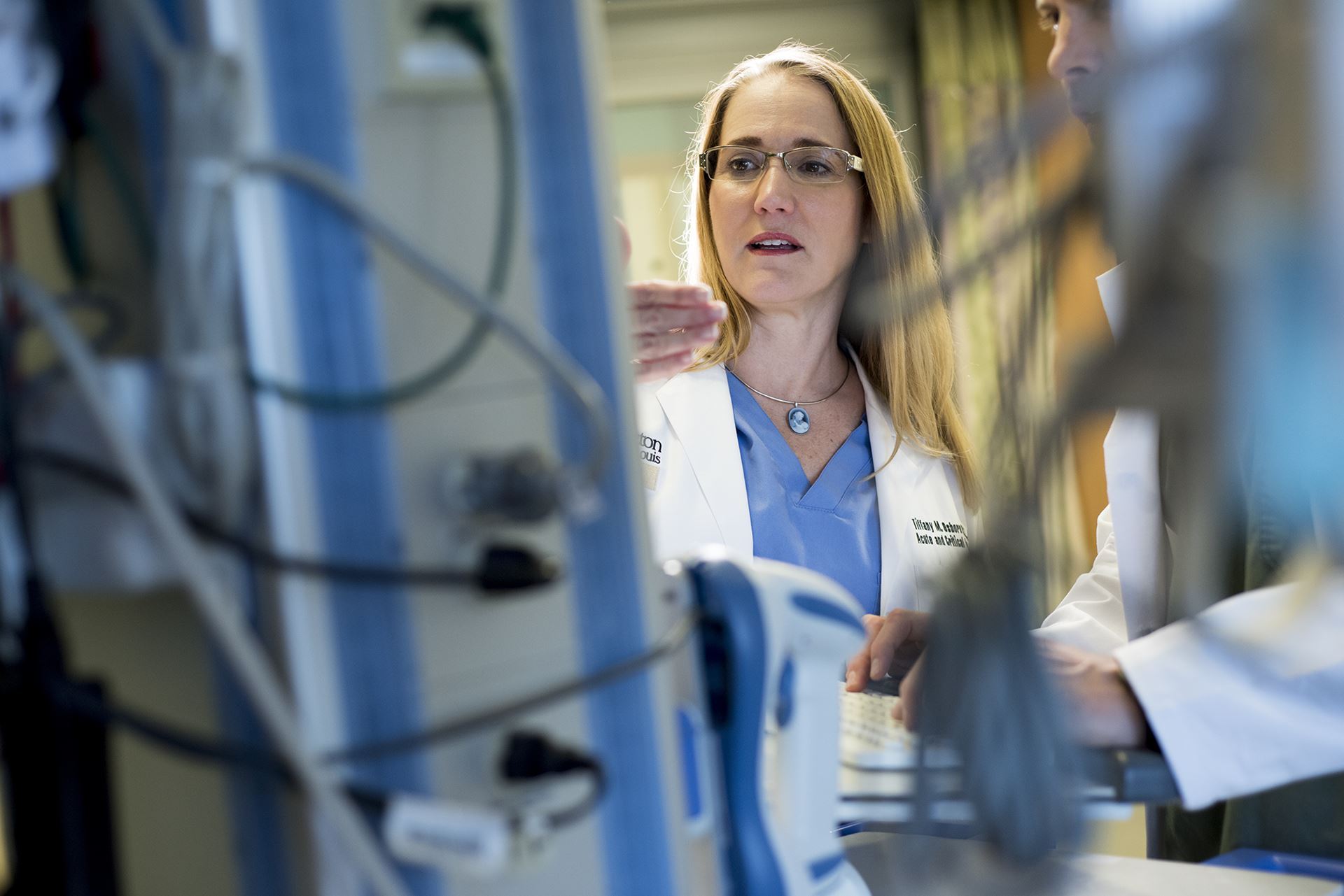 Robert Boston Photographer Dr. Tiffany Osborn in Surgery Care Unit with Shawn Reynolds Anesthesiology Physician Assistant Emergency Department at Barnes.