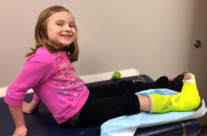 Cerebral palsy patient Alexa Reed prepares for the removal of her PERCS cast and the first step toward learning to use her new legs, now free from spasticity.